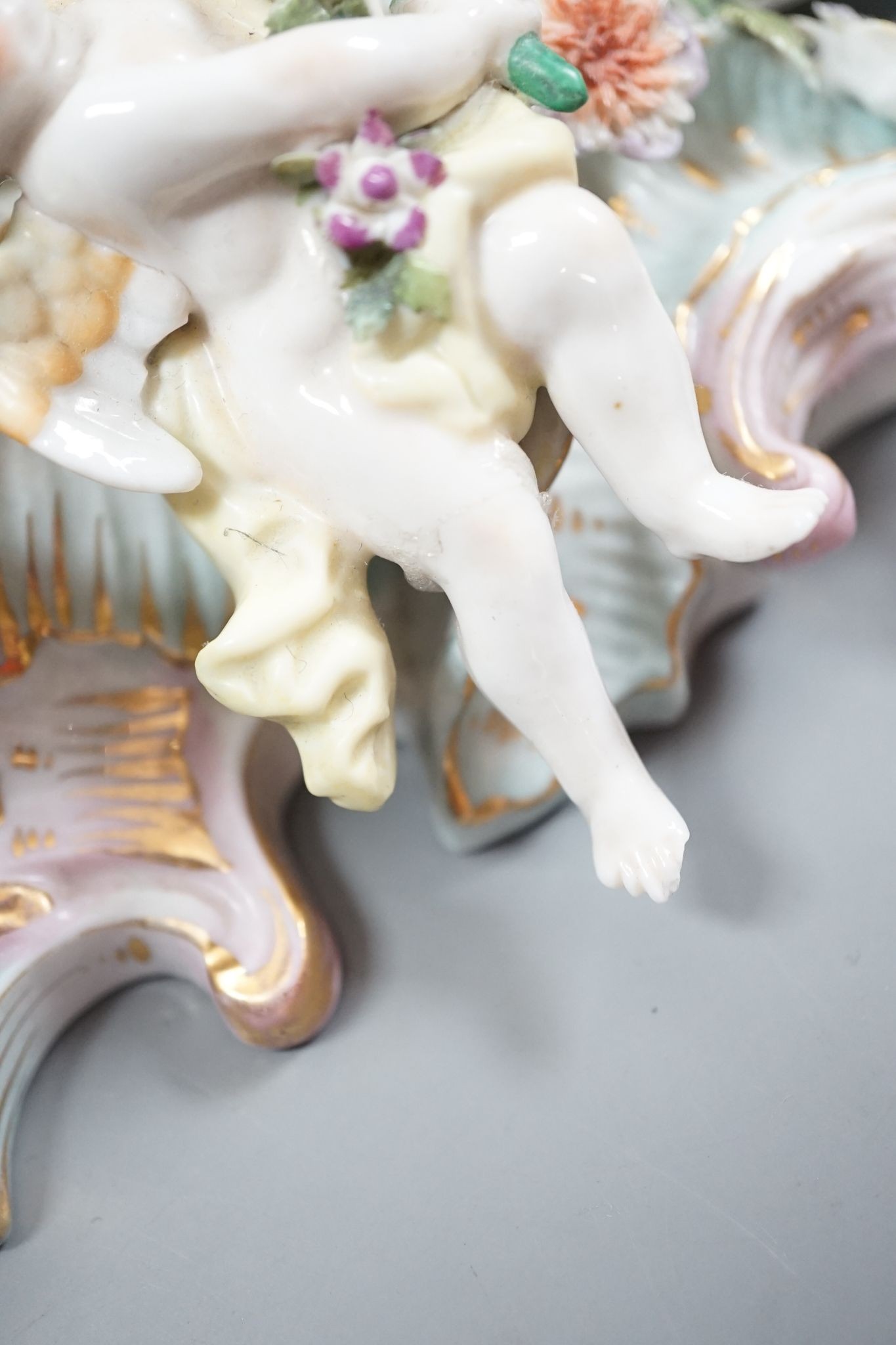 Two Sitzendorf porcelain ceiling shades, a similar wall bracket and a Dresden white glazed wall bracket, shades 30cm diameter